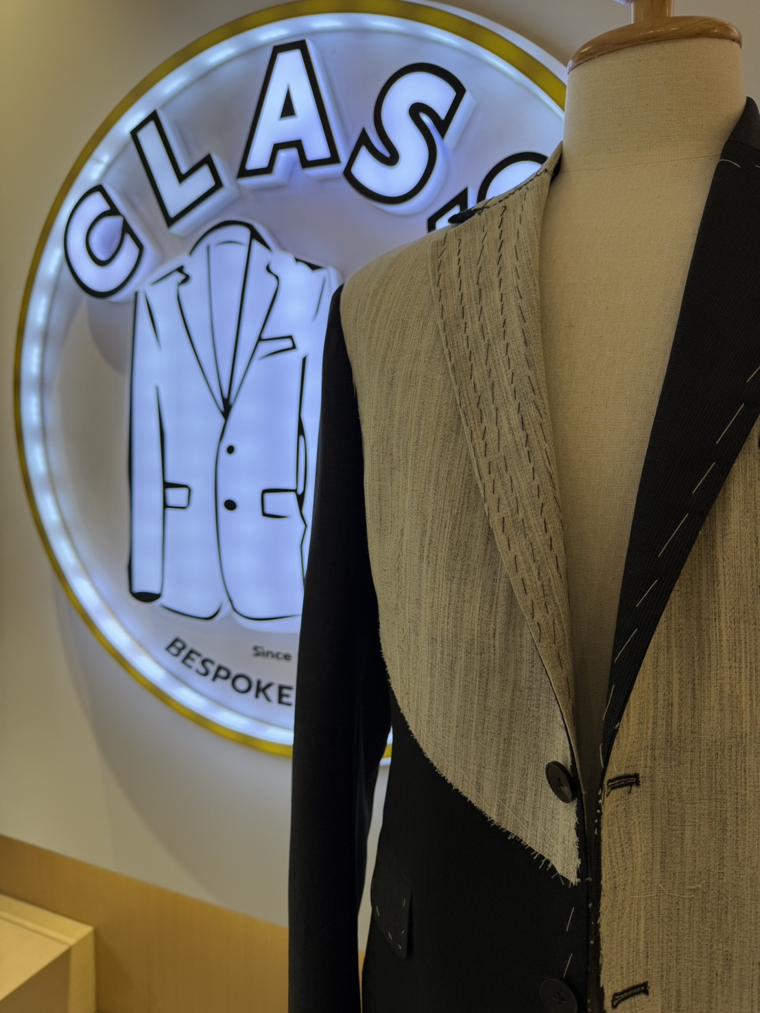 Custom tailored jackets inside a bespoke tailor shop in Bangkok